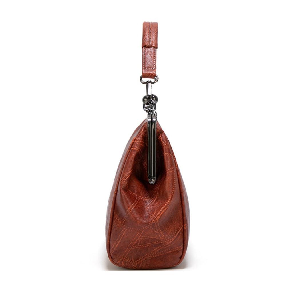 Vintage handtas met kissing sluiting