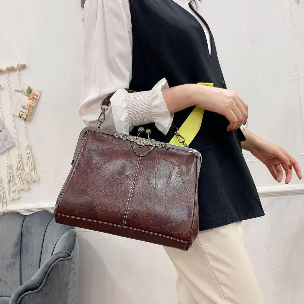 Vintage handtas met kissing sluiting