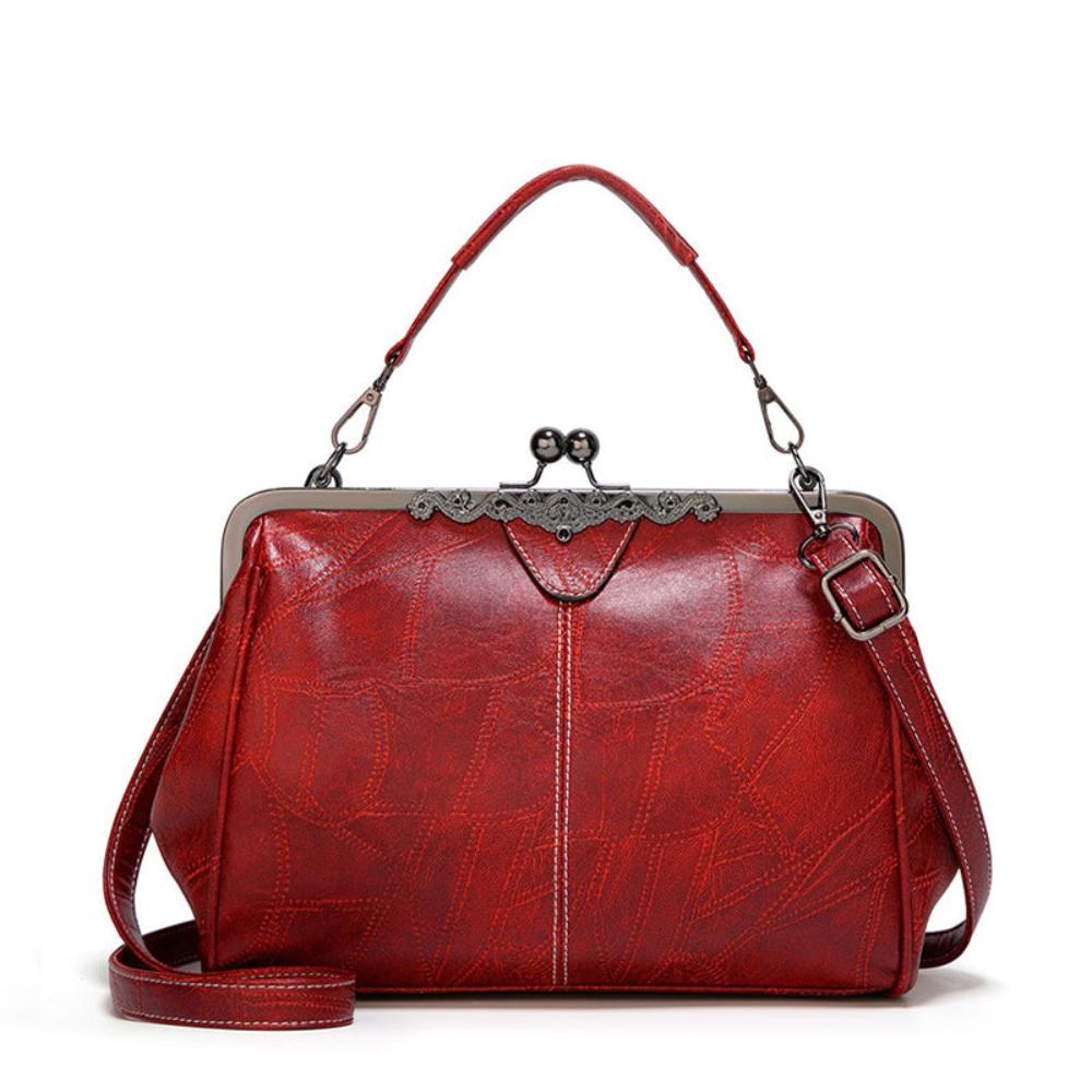 Vintage handtas met kissing sluiting